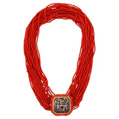 Exceptional vintage Shakudo necklace with a Japanese Menuki. A great piece of art, created probably in Italy around the 1960 to 1970. This colorful necklace is carefully assembled and crafted in 18 karats yellow gold. with multiples natural Sardinian red coral beads (2 mm) strands. The main central decorative element is a genuine Japanese Menuki, depicting two dressed man's carrying a courtesan lady in a royal bunk. These piece is embellished around, with the same coral beads matching the strand Traditional Hallmarked Jewelry For Evening, Antique Handmade Rectangular Necklace, Traditional Handmade Necklaces For Formal Occasions, Traditional Red Beaded Necklace For Formal Occasions, Traditional Handmade Formal Necklace, Luxury Handmade Red Jewelry, Luxury Multi-strand Necklace For Gift, Formal Red Medallion-shaped Jewelry, Traditional Red Medallion Necklace