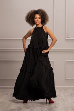 Stun the ones around you with your elegant style in this gorgeous long-flare maxi dress, which effortlessly brings out the diva in you.  The loose, oversized fit makes it airy and comfortable for those hot summer days, and the hem of the dress features a beautiful frill detail all over. This dress is perfect for elegant evening parties, proms, or cocktail parties. KEY FEATURES: - A-line silhouette - Dress with ruffles - Gathered scoop neck with a longbow over the back - custom size plus size ava Fitted Ankle-length Evening Dress, Elegant Ankle-length Evening Dress, Chic Midi-length Summer Gown, Chic Asymmetrical Maxi Dress For Wedding, Chic Midi Length Summer Gown, Elegant Ankle-length Maxi Dress For Party, Chic Maxi Dress For Wedding, Summer Evening Halter Neck Maxi Dress, Elegant Ankle-length Maxi Dress For Wedding