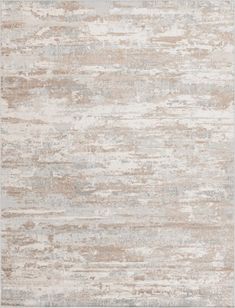 a beige and white rug with an abstract design on the bottom, it is very soft