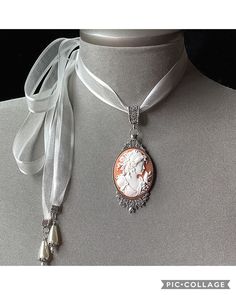 Peach Cameo Necklace! Perfect for any occasion!! The perfect "Mother's Day Gift"! A soft peach cameo set in an antique silver pendant and attached to a light cream organza ribbon.... I have added 2 light cream teardrop pearls to the end of each tie.... The perfect gift for that very special lady or teen Please select if you would like this item gift wrappedI will also include a quality card with your special message Thank you for taking time to browse my shop "Veronica Rose Designs" https://www. Rainbow Choker, Lesbian Gifts, Pride Necklace, Goth Choker, Cameo Jewelry, Vintage Cameo, Velvet Choker, Cameo Necklace, Silver Choker