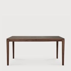 the table is made from dark wood and has a rectangular top with two leaves on each side