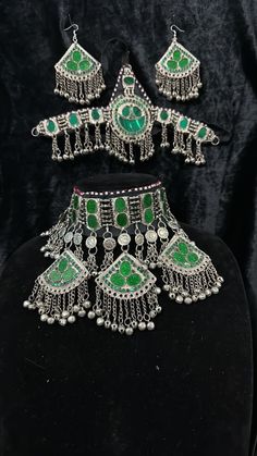 Exquisite Afghan Jewelry Set - Perfect for Special Occasions🇦🇫 Add a touch of exotic elegance to your look with our stunning Afghan jewelry set. Handcrafted by skilled artisans, each piece is a unique work of art that captures the rich cultural heritage of Afghanistan. This set includes a dazzling necklace, matching earrings, and a Tikka headpiece, all intricately designed with traditional Afghan motifs and embellished with vibrant gemstones. Bohemian Hand Set Jewelry For Ceremonial Occasions, Bohemian Beaded Chandbali Jewelry, Bohemian Chandbali Beaded Jewelry, Bohemian Hand Set Necklaces For Festive Occasion, Bohemian Hand Set Jewelry For Festive Season, Bohemian Hand Set Jewelry For Festive Occasions, Hand Set Bohemian Jewelry For Festive Season, Traditional Green Jewelry For Rituals, Bohemian Chandbali Jewelry For Rituals