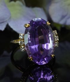 WE SELL NATURAL DIAMONDS ONLY !  Designer H. Stern 11ct Amethyst Diamond Ring 18K Gold Vintage Estate Jewelry  This is one of a kind vintage treasure crafted in rich 18K yellow gold. It is hallmarked by H. Stern (see picture) and there is a serial number. The center genuine earth mined vibrant purple amethyst measures 17.4mm x 11.5mm oval. It is estimated to be 11 carats. WOW!! Lovely purple  color!! Incredible brilliance! Flawless gem! There are 6 fiery round single cut diamonds. The diamonds are estimated to be clean VS-2 in clarity and HI in color (near colorless). Total diamond weight is estimated to be .18 carat. Gorgeous designer style mounting!! The presentation is raised 10.2mm high. Ring size 7 finger (easily sizable) and it weighs 5.6 grams.   Excellent condition.   Awesome! H.St Amethyst Vintage Ring, Lavender Amethyst Ring For Formal Occasions, Exquisite Oval Amethyst Ring For Formal Occasions, Formal Lavender Hallmarked Amethyst Ring, Formal Lavender Amethyst Ring Hallmarked, Formal Lavender Amethyst Ring With Oval Shape, Formal Lavender Oval Amethyst Ring, Timeless Purple Rings For Formal Occasions, Elegant Yellow Gold Amethyst Ring With Brilliant Cut