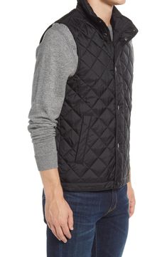 Lightweight and layerable, this quilted nylon vest sports pockets inside and out plus a stand collar and covered placket to help keep the elements at bay. 27 1/2" length (size Medium) Two-way front zip closure with snap storm placket Stand collar Lined, with synthetic fill 100% nylon Dry clean or machine wash, line dry Imported Wind Blocking, Quilted Gilet, Outdoor Jackets, Mens Outdoor Jackets, Quilted Vest, A Stand, Diamond Quilt, Winter Season, Welt Pockets