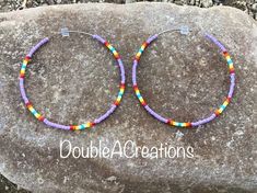 "Here's a pair of purple with native colors beaded hoop earrings that are lightweight and comfortable to wear all day long. Made with high quality glass Delica Beads, beaded one bead at a time. Love and passion goes into making my jewelry. This process requires focus, patience and dedication. Each bead is 16th of an inch and can take hours to complete a project. They are 2\" around.  They would be a great addition to your wardrobe. This would make a great gift for someone special or a treat for yourself. Handmade is from the Heart ❤️ Handmade in Arizona 🇺🇸 Thank you for stoping by.  Have a great day." Jewelry Board, Jewelry Boards, Delica Beads, Beaded Hoop Earrings, Beaded Hoops, Bead Jewelry, Seed Bead Jewelry, Jewelry Earrings Hoops, Seed Bead