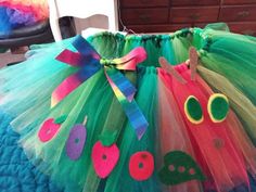 a close up of a dress made to look like a caterpillar with eyeballs on it