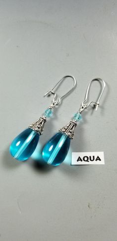 These Beautiful Earrings are made with Translucent Glass Teardrop Beads topped off with unusual Tibetan Silver Bead Caps and Crystal beads that compliment the different colors of Teardrops. You have your choice of 10 pretty colors ! They are 1-1/2 inches long ( not including  the silver plated Kidney style ear wires ) and are light weight. Thanks so much for looking ! I have a second Etsy Shop with my line of Fine Sterling Silver and Stone Jewelry. Please check it out at: www.etsy.com/shop/Cathy Cheap Nickel-free Beaded Drop Earrings, Cheap Teardrop Beaded Earrings, Dyi Earrings, Diy Earrings Dangle, Jewlery Earrings, Diy Earrings Easy, Diy Jewelry Rings, Crystal Bead Jewelry, Beaded Earrings Diy