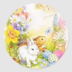 a plate with an image of rabbits and flowers on it