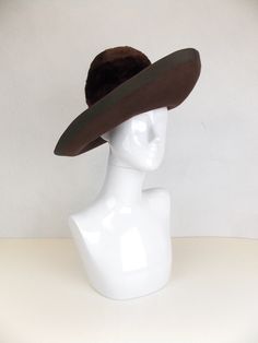 "1960's vintage rich chocolate brown felt hat with large dramatic brim and grosgrain hatband. This hat is in beautiful vintage condition. In very good vintage condition. Estimate size 21 Label: Otto Lucas, made in England Crown height 5\" Brim 4\" Inside brim 21\" We have many hats listed in our store. Check them out here:  https://www.etsy.com/shop/ofcorsetsvintage?section_id=14391072&ref=shopsection_leftnav_7 But why just limit yourself to one? We offer discount shipping when purchasing multip Brown Felt Hat, Vintage Wiggle Dress, Crown Heights, Black Slip Dress, Felt Hat, Hat Band, Black Slip Ons, 1960s Vintage, Hat Sizes