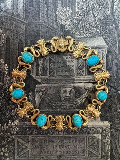 Egyptian revival jewelry became wildly popular during the Art Deco period after King Tut's tomb was opened in 1922. This wonderfully wearable bracelet features six bezel-set turquoise scarabs mounted between sculpted asps and papyrus frond stations,  finished with a tiny pharaoh closure. 7.25" in length, fabricated in 14k yellow gold.  Measurements: 7 1/4" long by 5/8" wide Weight: 18.8 grams Markings: none Art Deco Egyptian, Egyptian Revival Jewelry, Scarab Bracelet, King Tut, Egyptian Revival, Art Deco Period, Antique Collection, Chain Link Bracelet, Monster High