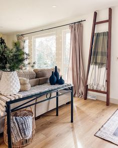 a living room filled with furniture and a christmas tree