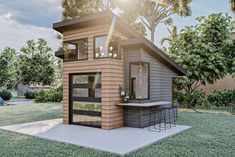 a small house sitting on top of a lush green field