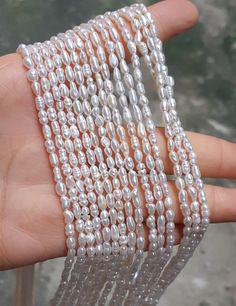 "3-5mm Grade AA High Quality Natural Freshwater Baroque Seed Nugget Keshi Pearl Beads - White 14.5\" strand PB850 Material genuine freshwater pearl, fully drilled Qty 1 strand/PKG, 14.5 inches around Color white Size 3-5mm Good luster Please note that it is estimated size More quanity? Wholesale price? Convo us!" Pearl White Baroque Pearl Beaded Necklace With Round Beads, Pearl White Baroque Pearl Beaded Necklaces, Pearl White Baroque Pearl Beaded Necklace, White Pearl Beaded Necklace In Rondelle Shape, White Pearl Beaded Necklaces In Rondelle Shape, White Pearl Necklace With Spacer Beads, White Baroque Pearl Beads For Jewelry Making, White Baroque Pearl Beaded Necklaces For Jewelry Making, Hand-strung White Pearl Necklace For Wedding