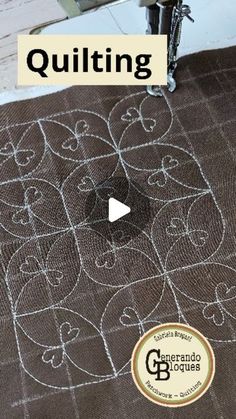 the video is showing how to make quilting with machine and thread on top of it