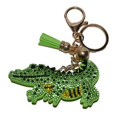 a key chain with a green alligator on it