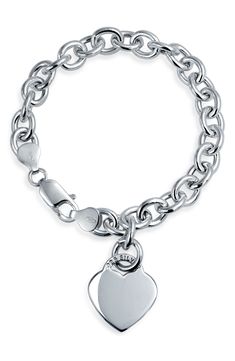 A gleaming heart charm dangles from a sterling silver chain, creating a beautiful bracelet that is the perfect gift for your sweetheart. Sterling silver chain bracelet with heart charm. Lobster clasp. Approx. 7.5" chain length. Imported