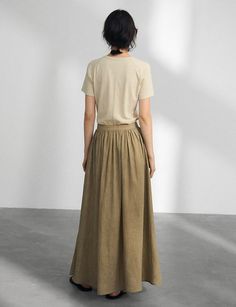 Khaki midi full skirt. Styled with one shoulder knot top. 92.5% lyocell 7.5% linenLinedSide zip closureS waist 27.5"/ 69 cmM waist 28.5/ 73 cmTotal length 36.5"/ 93cm Imported Khaki Midi Skirt, Shoulder Knots, Pixie Market, Full Midi Skirt, Knot Top, Midi Maxi Dress, Short Jumpsuit, Knit Shirt, Long Blouse