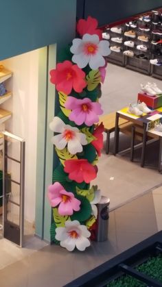 an arrangement of fake flowers on display in a store