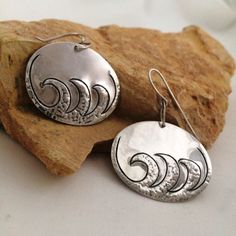 Passing Through Waters Uniquely hand made sterling earrings, outstanding on, comfortable and personally encouraging meaning.  These earrings have an artistically hand chased design with repousse texture raising the wave effect from the back, gentle dangling motion from hand made sterling loop and ear wire....a great gift for her, or for you!  MEASUREMENTS: Length:  1 3/8 inches   Height 1 7/8   inch  ozt. .35   DESIGN: Strong reminder that The Almighty God who never changes, will take you throug Artistic Silver Jewelry With Stamped Details, Artistic Silver Jewelry, Stamped, Artistic Silver Jewelry Stamped, Silver Stamped Earrings For Everyday, Sterling Silver Etched Jewelry For Gifts, Sterling Silver Etched Jewelry As Gift, Artistic Etched Jewelry For Gifts, Etched Sterling Silver Jewelry As Gift, Everyday Silver Stamped Earrings