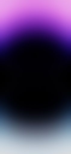 an abstract blurry background with black and purple colors in the middle, as well as white