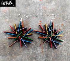 "Beautiful and colorful hand-painted earrings by artists from Guadalajara, Mexico. Inspired by the cover of Depeche Mode's album \"Sounds of the Universe\".  with the music of the band Pink Floyd. The earrings are made with 3 layers of wood to give a 3D effect. Includes 1 pair of hand-painted earrings, a certificate-card with the original signature of the artist who painted them (each piece is also signed on the back)  :) Specifications, measurements and shipping: Measurement: 1.18 in long X 1.77 in wide approximately. - STAINLESS STEEL. (Hook and ring) - MDF wood painted with acrylic paints and high protection varnish. -Treat with care as they are small pieces of art hand painted detail by detail, do not expose them to water or vapors. -Hand painted earrings made in Guadalajara, Mexico :) Artistic Multicolor Earrings With Colorful Design, Funky Multicolor Hand Painted Jewelry, Artistic Multicolor Earrings, Artistic Colorful Earrings, Depeche Mode Albums, Sounds Of The Universe, Rock Accessories, Hand Painted Earrings, Painted Earrings