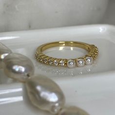 "Beautiful, 14k gold plated, dainty pearl purity ring.  \"Blessed are the pure in heart, for they shall see God.\" Matthew 5:8 <3 * Made of 925 Sterling Silver * THICK plating of 14k Gold All sales are Final Sale on all Purity Rings, so make sure you know your correct measurements + ring size! :)" Gold Pearl Halo Ring Gift, Gold Pearl Ring With Halo, Gold Halo Pearl Ring For Gift, Gold Pearl Ring With Halo For Gift, Gold Timeless Pearl Promise Ring, Timeless Gold Pearl Promise Ring, Everyday Gold Ring With Pearl Charm, Stackable Pearl Ring For Anniversary, Classic Adjustable Gold Pearl Ring