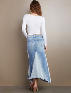 Wash Lab Denim is leading the Return of the Maxi! Shimmy smooth in the Selma Pieced Denim Maxi Skirt, a blast from the past pieced denim skirt with fray hem detail. The model is 5'9" wearing a size 26 Fabric: 72% Cotton 17% Rayon 10% Polyester 1% Spandex Length: 37½" from waistband to longest point Upcycling Clothes, Below The Knee Dresses, Cowgirl Fashion, Denim Vests, Denim Overall Dress, Denim Maxi, Cropped Flare Jeans, Blast From The Past, Denim Maxi Skirt