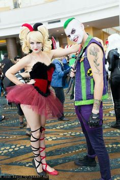 two people in costumes standing next to each other