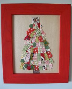 a red frame with a christmas tree made out of scrap paper on the bottom, and an ornament in the middle