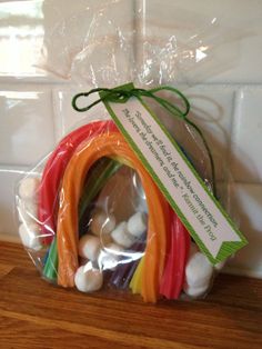 a bag filled with assorted vegetables on top of a wooden table