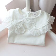 4 / 2T White Lapel children's bottom T-Shirt Cute Tops With Doll Collar For Spring, Cute Shirt With Doll Collar For Spring, Cute Doll Collar Shirt For Spring, Cute White Blouse With Doll Collar, Cute White Top With Doll Collar, Summer Cotton Top With Doll Collar, Spring Crew Neck Top With Lace Collar, White Blouse With Doll Collar In Cute Style, White Long Sleeve Tops With Lace Collar