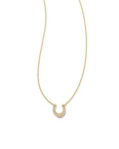 Add a dainty symbol of luck to your necklace stack with the Noble 14k Yellow Gold Horseshoe Short Pendant Necklace in Turquoise. The classic horseshoe shape is elevated with long-lasting 14k Gold and a petite white diamond stud. This necklace is a part of Yellow Rose by Kendra Scott—a brand that celebrates ranch life with Kendra Scott staples alongside select curated jewelry pieces and accessories. We have taken steps to ensure that, when applicable, our diamonds are conflict free by requiring our suppliers to comply with the Kimberley Process. Metal 14k Yellow Gold Closure Spring Ring Clasp Size 18" Chain With 2"Extender, 0.31"L X 0.32"W Diamond Quality Diamond H SIDue to the one-of-a-kind nature of the medium, exact colors and patterns may vary slightly from the image shown. | Kendra Sco Short Pendant Necklace, Gold Horse, Yellow Gold Pendants, Gold Pendant Necklace, Yellow Rose, Quality Diamonds, Huggies Earrings, Kendra Scott, Diamond Studs