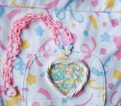 "Polymer clay pastel marshmallow twist heart filled with a transparent \"glass\" film with sprinkles inside The marshmallow border is sealed with a satin glaze   Perfect for everyday kawaii and fairy kei looks! The heart measures approx 2.5 inches long and 2.75 inches across, chain hangs approx 11 inches long with a plastic heart-shaped lobster clasp Please message me if you have any questions or concerns. PLEASE NOTE: ** Polymer clay is waterproof, washable, and durable however please understand that doesn't mean it is indestructible so please take care as you would any other jewelry piece All of my items are handmade and therefore are subject to slight imperfections but please know they were created and treated with the utmost care and love. I would never sell anything that I myself woul Decora Kei Outfits, Kei Jewelry, Pastel Jewelry, Necklace Fairy, Yume Kawaii, Twisted Heart, Cute Stuff, Glass Film, Colourful Outfits