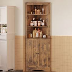 an old wooden cabinet in the corner of a bathroom with soaps and lotions on it