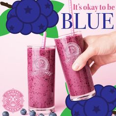 two glasses with blueberries in them and the words it's okay to be blue