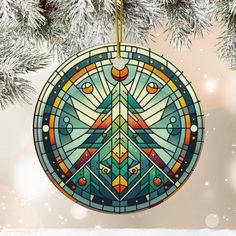 a peace sign ornament hanging from a christmas tree