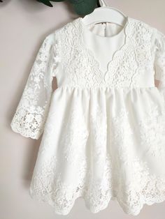 ♡ This is handmade and unique girl dress below knee-length and with long sleeves.  ♡ MADE OF: Ecru marchiano with ecru lace. The lining is made of 100% cotton ♡ Processing time is usually 5-7 days.  ♡ CARE INSTRUCTIONS: Wash in cold or warm water (30oC/ 65 - 85F). Do not use bleach. Dry at low temperatures, do not use machine drying. Iron at medium or low temperature. Hand wash and hang dry for longer wear. Bridesmaid Dress With Lace Bodice, Elegant Lace Dress For Baptism Party, Elegant Baptism Dress With Lace Trim For Party, White Lace Dress With Lace Bodice For Ceremonies, Cream Baptism Dress With Lace Bodice, Lace Baptism Dress With Lace Trim For Party, Elegant Dress With Lace Sleeves For Ceremony, Elegant Lace Patchwork Dress For Ceremony, Elegant Dresses With Lace Patchwork For Ceremony