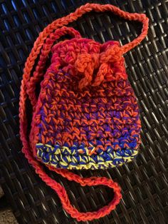 a crocheted purse sitting on top of a table