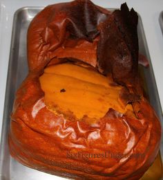 a baked pumpkin is sitting on a tray