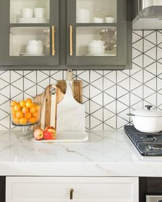 the kitchen counter is clean and ready to be used for cutting oranges or apples