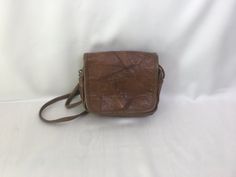 "Vintage 80's patched leather cocoa/cappuccino brown handmade purse, crossbody bag. Retro design purse boho casual rustic ladies accessories. Inside is textile lining, 1 large compartment, 1 frontal open way pocket and 1 zippered back compartment. condition: great vintage. Has small scratches on the leather surfaces around the magnetic closure (on bottom). Without seriously damages. measurements: height: 16,5 cm / 6.4\" in width: 21 cm / 8.2\" in strap length (no adjustable): 130 cm / 50.7\" in" Vintage Brown Flap Bag, Vintage Brown Rectangular Flap Bag, Distressed Brown Crossbody Shoulder Bag For Travel, Vintage Brown Flap Shoulder Bag, Vintage Brown Crossbody Flap Bag, Brown Satchel With Cell Phone Pocket, Distressed Brown Leather Shoulder Bag With Rectangular Shape, Distressed Brown Rectangular Shoulder Bag With Leather Backing, Vintage Brown Flap Bag For Travel