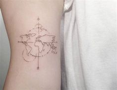 a person with a tattoo on their arm that has a world map and arrows drawn on it