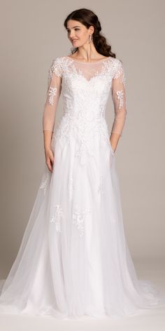 A luxurious bridal gown with long sleeves and delicate silhouettes? Envision yourself walking down the aisle in a dress that is hugging your figure and gracing you down the aisle. This Long Sleeve Lace Applique A Line Ball Gown with an embroidery sweetheart neckline compliments every curve while still enabling you to move on the dance floor. Fitted A-line Mother Of The Bride Dress For Wedding, Long Sleeve Dress With Illusion Neckline And Fitted Bodice, Long Sleeve Tulle Dress For Debutante Ball, Wedding Gown With Illusion Neckline And Long Sleeves, Long Sleeve Wedding Gown With Illusion Neckline, Long Sleeve Dresses With Sheer Fitted Bodice, Long Sleeve Tulle Gown With Sheer Sleeves, Long Sleeve Lace Bodice Wedding Dress, Tulle Gown With Sheer Long Sleeves