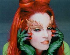 an advertisement for blvd magazine featuring a woman with red hair and green gloves