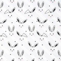 black and white bunny ears on a white background with tiny holes in the middle to make them look like they're looking at something