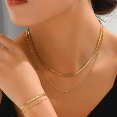 ✦ The Collection is all about celebrating the beauty of simple connections. The star of the show is our layering chain, which seamlessly links two necklaces with a delicate gold bead. The second layer features a subtle flat snake chain that really makes that gold bead shine. We know you're a fellow lover of all things minimal and gold! ----------- DETAILS ----------- - Color: Gold/ Silver - Outer Chain Length: 37+5cm - Inner Chain Length: 43+5cm - Materials: 18K Gold Plated, 316L Stainless Steel Mismatched Earrings Studs, Gold Herringbone Chain, Flat Snake Chain, Two Necklaces, Herringbone Chain, Necklace Layered, Earring Jackets, Climber Earrings, Mismatched Earrings