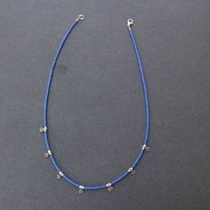 Single strand of round turquoise or lapis lazuli stones and silver beads Approximately 18 inches long Adjustable Blue Jewelry With Silver Beads, Blue Sterling Silver Single Strand Necklace, Blue Sterling Silver Jewelry With Tiny Beads, Sterling Silver Blue Jewelry With Tiny Beads, Adjustable Blue Necklace With Silver Beads, Blue Sterling Silver Single Strand Jewelry, Blue Lapis Lazuli Necklace With Spacer Beads, Blue Spiritual Necklace With Spacer Beads, Blue Turquoise Necklace With Spacer Beads As Gift