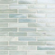 a close up view of a glass tile wall with white and gray colors on it