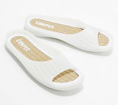 Sleek, simple, and oh-so-comfy, these slide sandals are ready for those relaxing evenings on the deck, hot summer days by the pool, and weekend trips to the beach. From Camper. Lightweight Slippers For Beach In Spring, Comfortable Lightweight Open Toe Slippers, Comfortable Beach Slippers With Removable Insole, Comfortable Slippers With Removable Insole For Beach, Comfortable Lightweight Flip Flops For Vacation, Lightweight Summer Sandals For Vacation, Lightweight Summer Sandals, White Open Toe Leisure Slippers, Lightweight Sandals With Removable Insole For Summer