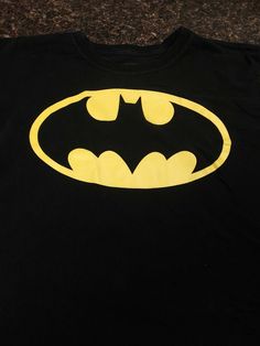 DC Comics Batman black T-shirt, kid size XXL (18) black. Short sleeve, no stains,  rips or tares.  Condition is Pre-owned. Shipped with USPS First Class Package. Black Tops With Screen Print For Fan Conventions, Black Screen Print Tops For Fan Conventions, Black Crew Neck T-shirt With Pop Culture Style, Black Graphic Tee For Fan Conventions, Black Graphic Print Top For Fan Conventions, Black Band Merch Tops For Fan Conventions, Band Merch Black Tops For Fan Events, Black Short Sleeve Top For Fan Conventions, Pop Culture Black T-shirt For Fan Merchandise